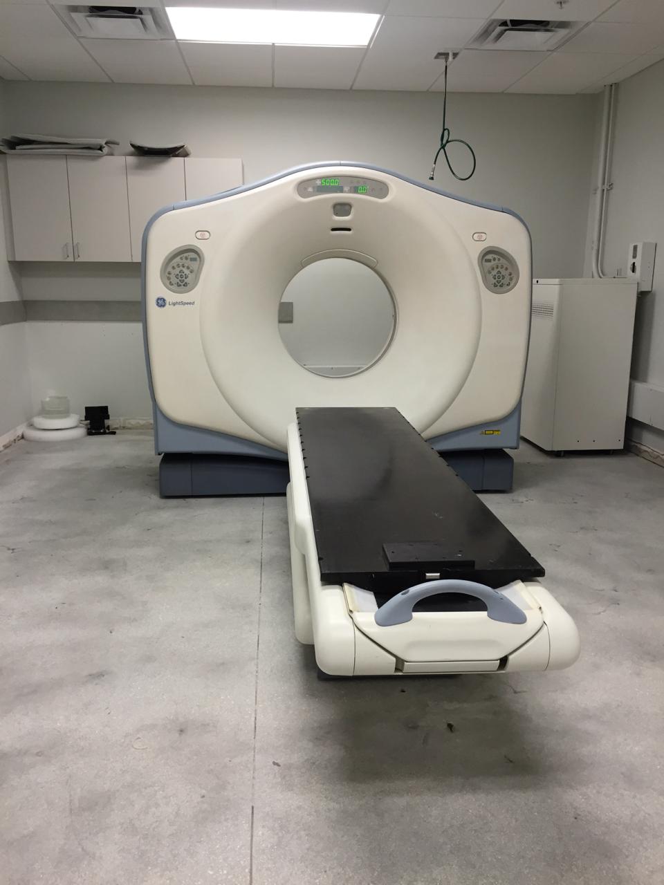 CT scanner staged for evaluation as non-working medical imaging equipment.