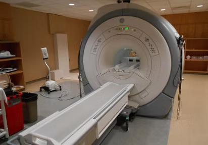MRI scanner in an imaging room for used MRI equipment valuation.